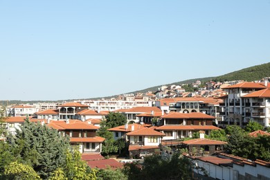 Photo of Sveti Vlas, Bulgaria - July 13, 2025: Beautiful buildings, trees and green mountain