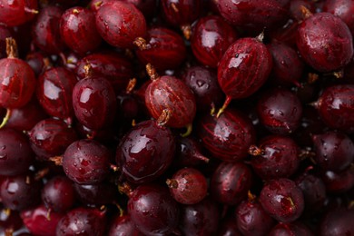 Photo of Fresh ripe red gooseberries as background, closeup