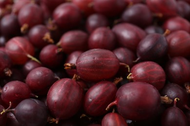 Photo of Fresh ripe red gooseberries as background, closeup