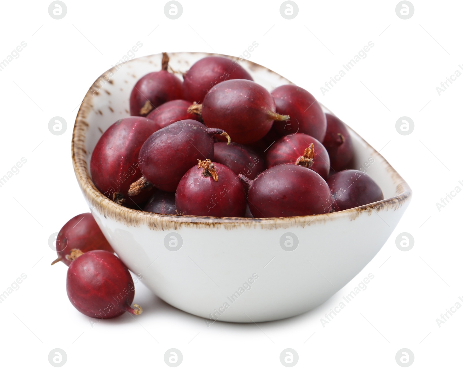 Fresh ripe red gooseberries in bowl isolated on white Photo of Fresh ripe red gooseberries in bowl isolated on white