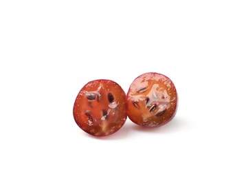 Photo of Halves of fresh ripe red gooseberry isolated on white