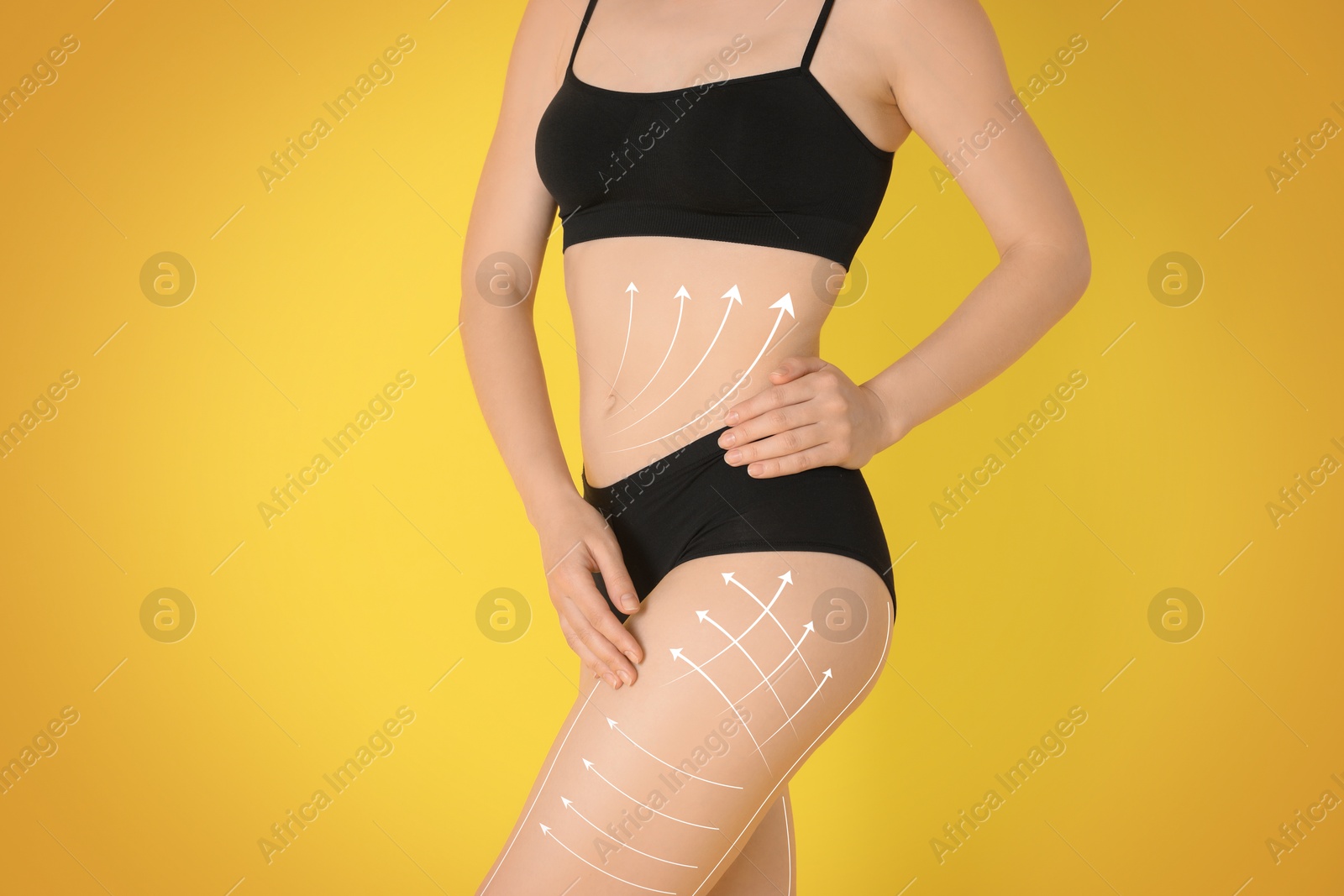 Image of Liposuction. Woman with perfect figure against orange gradient background, closeup. Markings on her body