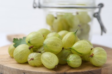 Photo of Fresh ripe green gooseberries on table, closeup
