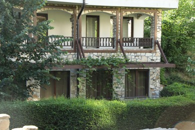 Photo of Beautiful building surrounded by different green plants