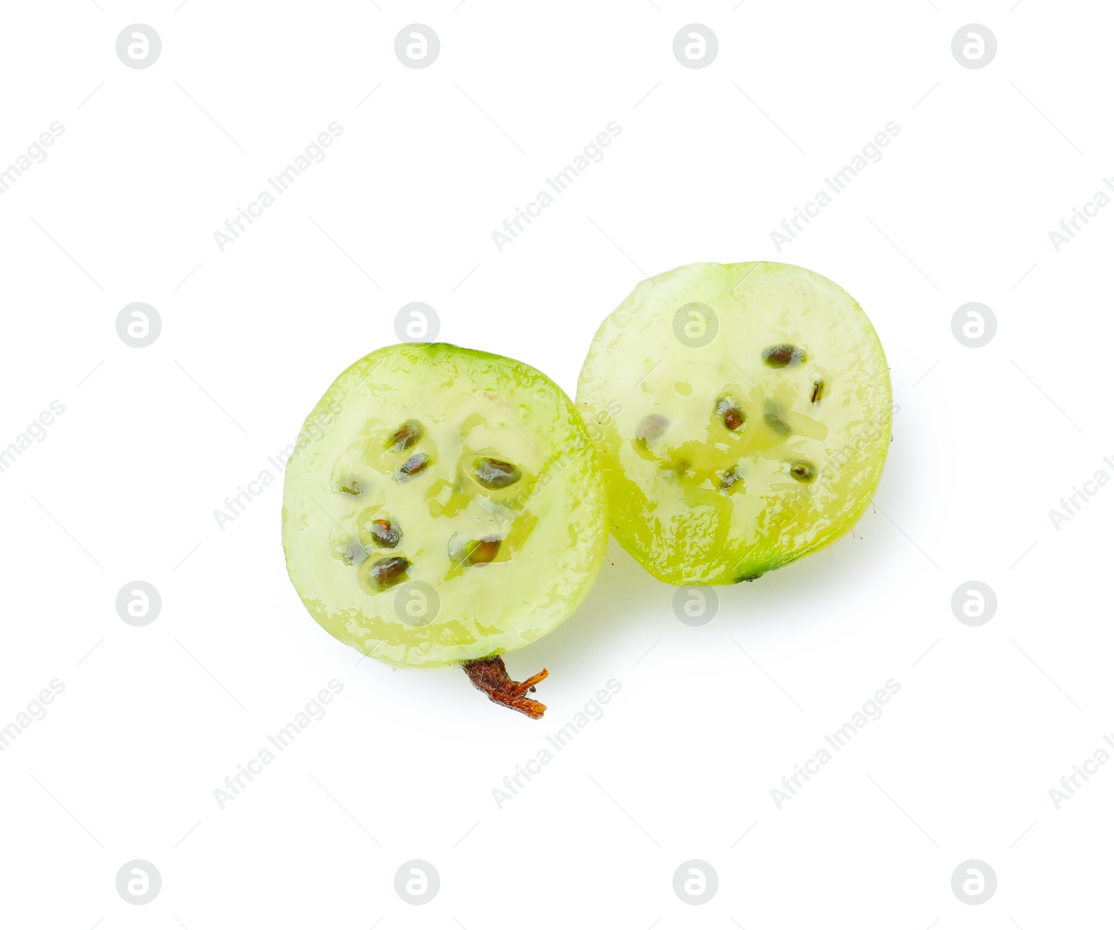 Halves of fresh ripe green gooseberry isolated on white, top view Photo of Halves of fresh ripe green gooseberry isolated on white, top view
