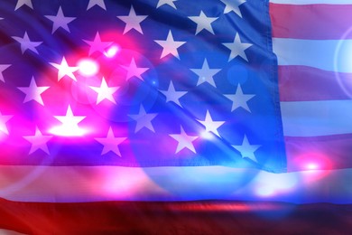 Image of Police red and blue lights, double exposure with flag of United States of America