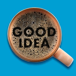 Image of Cup of coffee on blue background, top view. Good Idea words on froth