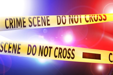 Image of Police red and blue lights and yellow Crime Scene Do Not Cross tape