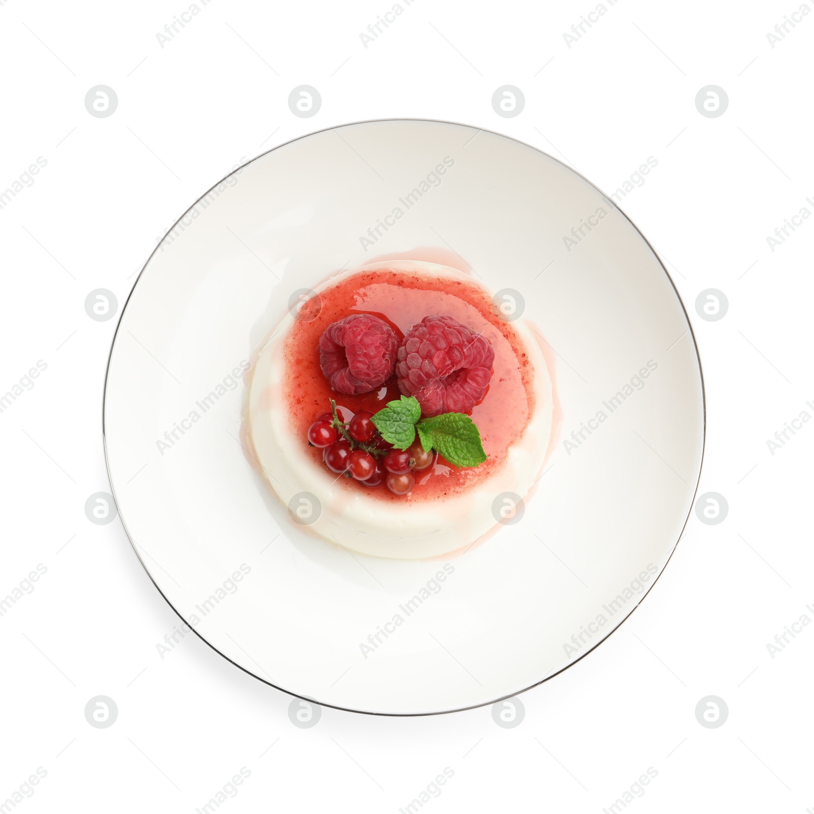 Photo of Delicious panna cotta with berries, sauce and mint isolated on white, top view