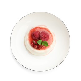 Photo of Delicious panna cotta with berries, sauce and mint isolated on white, top view