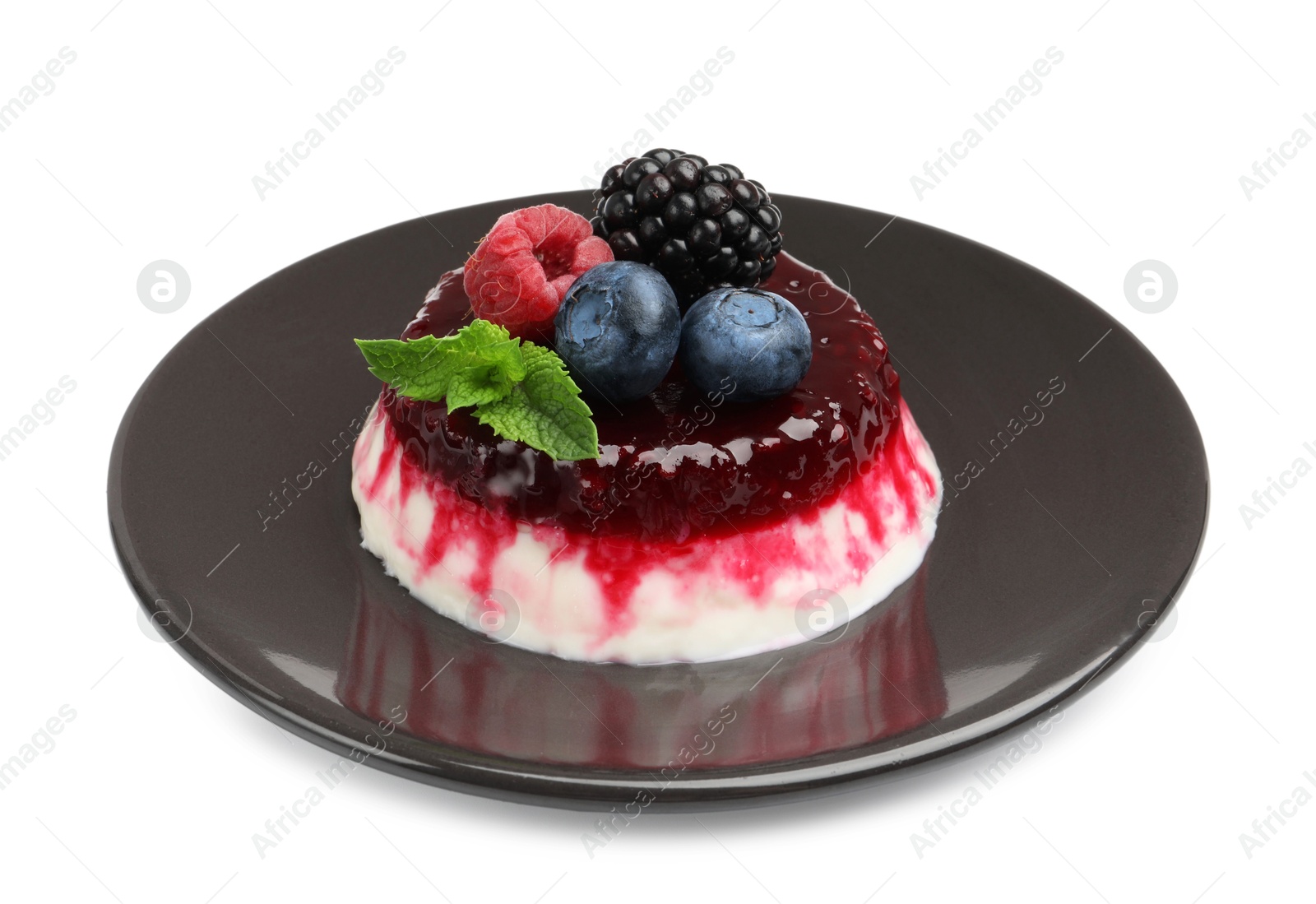 Photo of Delicious panna cotta with berries, jam and mint isolated on white