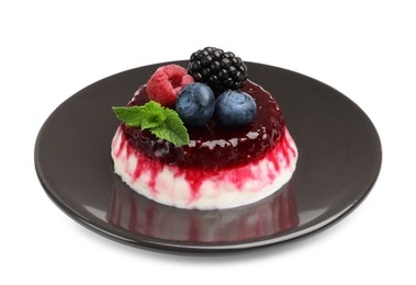 Photo of Delicious panna cotta with berries, jam and mint isolated on white