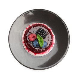 Photo of Delicious panna cotta with berries, jam and mint isolated on white, top view