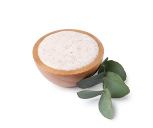 Photo of Natural body scrub in bowl and eucalyptus branch isolated on white