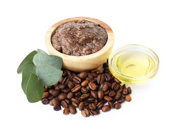 Photo of Natural body scrub in bowl, coffee beans, oil and eucalyptus branch isolated on white