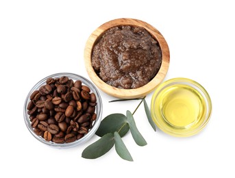 Photo of Natural body scrub, coffee beans, oil and eucalyptus branch isolated on white, top view