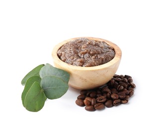 Photo of Natural body scrub in wooden bowl, coffee beans and eucalyptus branch isolated on white