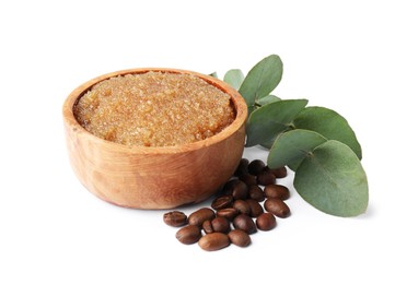 Photo of Natural body scrub in wooden bowl, coffee beans and eucalyptus branch isolated on white