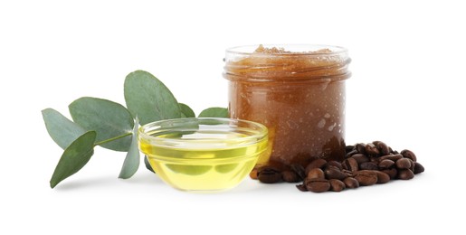 Photo of Natural body scrub in glass jar, coffee beans, oil and eucalyptus branch isolated on white