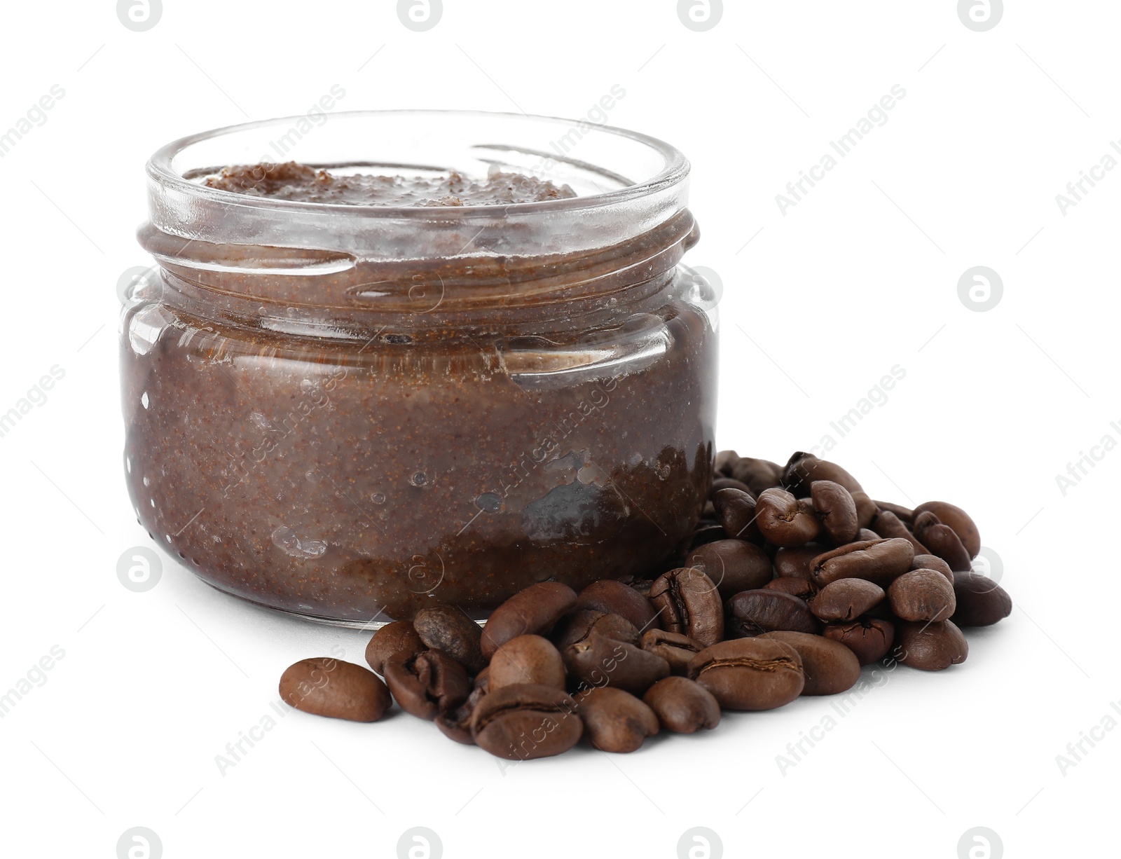 Natural body scrub in glass jar and coffee beans isolated on white Photo of Natural body scrub in glass jar and coffee beans isolated on white