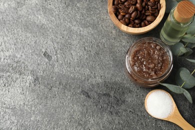 Photo of Natural body scrub in glass jar and ingredients on grey table, flat lay. Space for text