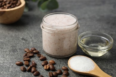 Photo of Natural body scrub in glass jar and ingredients on grey table, closeup