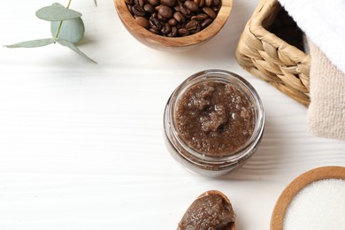 Photo of Natural body scrub, ingredients and towels on white wooden table, flat lay. Space for text