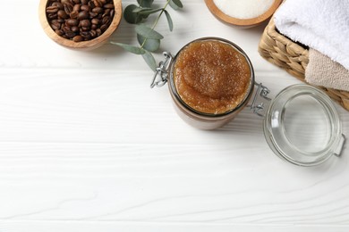 Photo of Natural body scrub, ingredients and towels on white wooden table, flat lay. Space for text