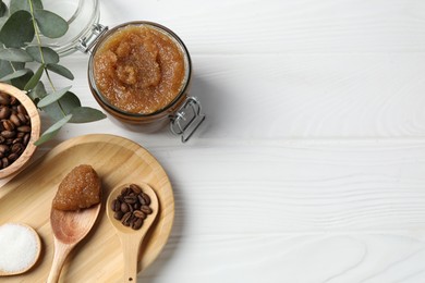Photo of Natural body scrub and ingredients on white wooden table, flat lay. Space for text