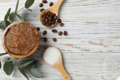 Photo of Natural body scrub in bowl and ingredients on wooden table, flat lay. Space for text