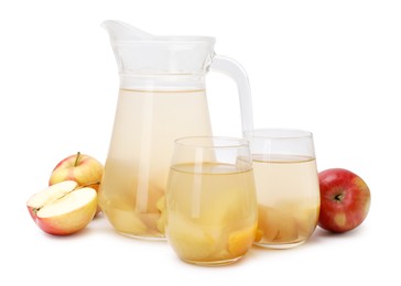 Photo of Tasty compot in glasses, jug and fresh apples isolated on white