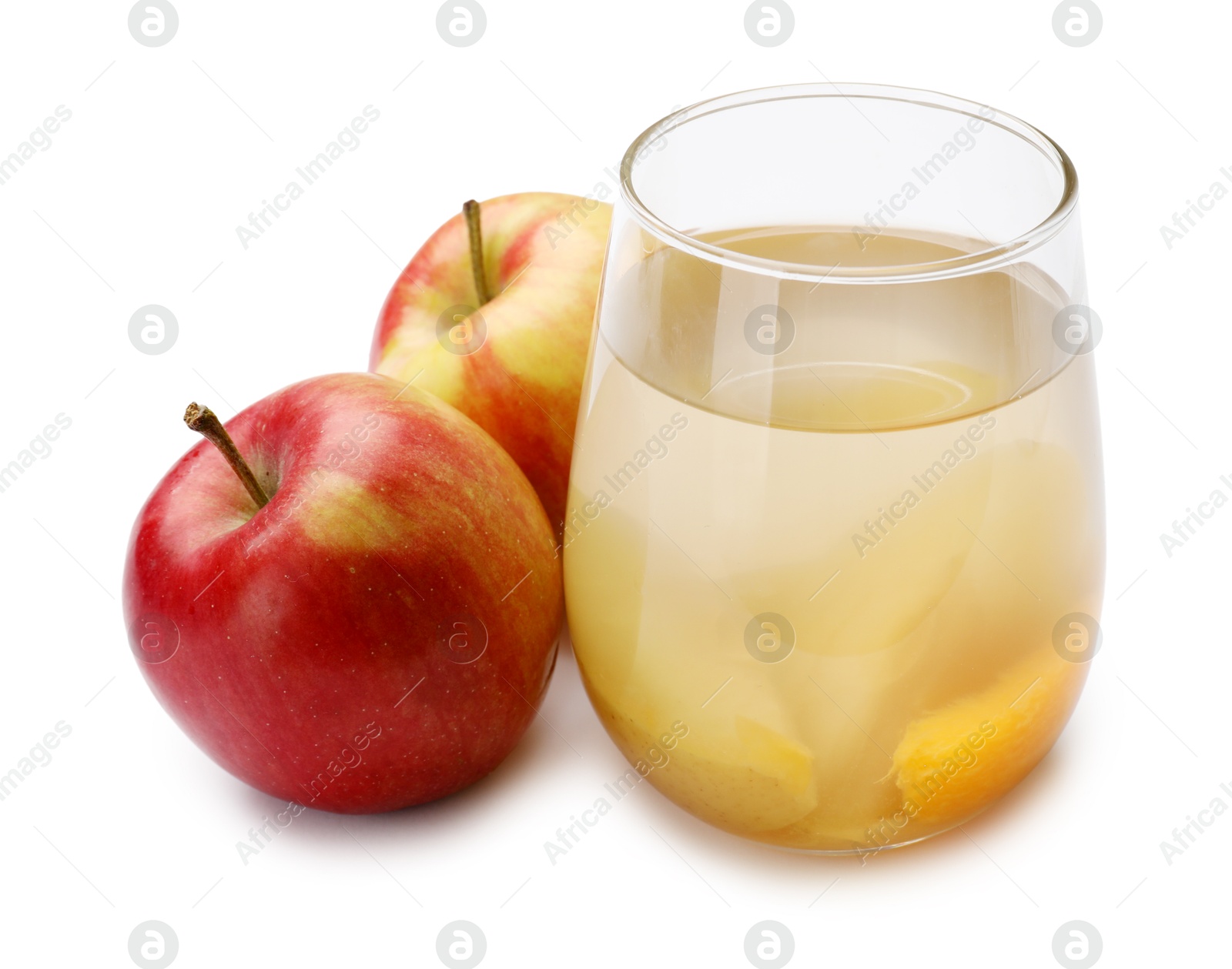 Photo of Tasty compot in glass and fresh apples isolated on white