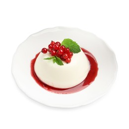 Photo of Delicious panna cotta with red currants, sauce and mint isolated on white