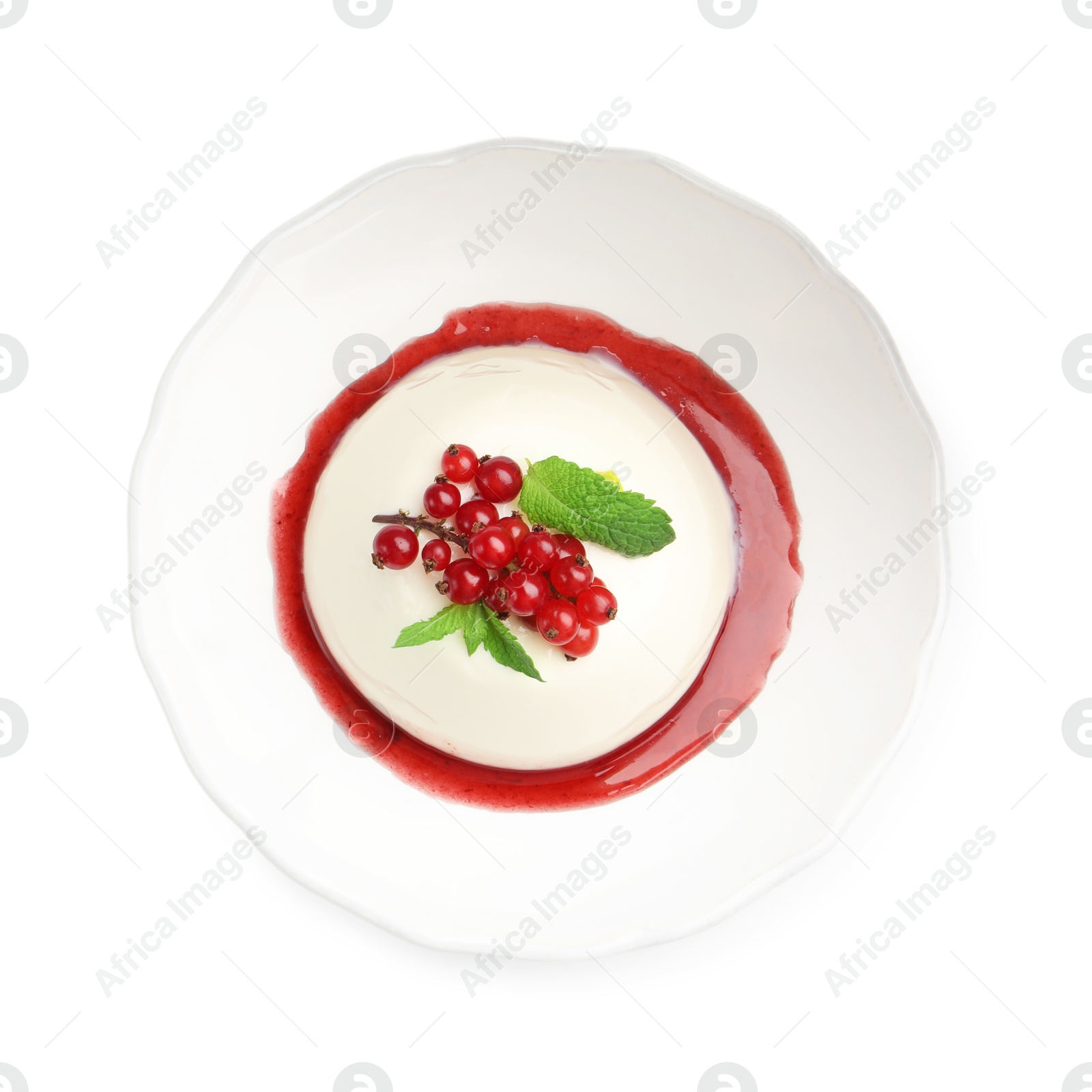 Delicious panna cotta with red currants, sauce and mint isolated on white, top view Photo of Delicious panna cotta with red currants, sauce and mint isolated on white, top view