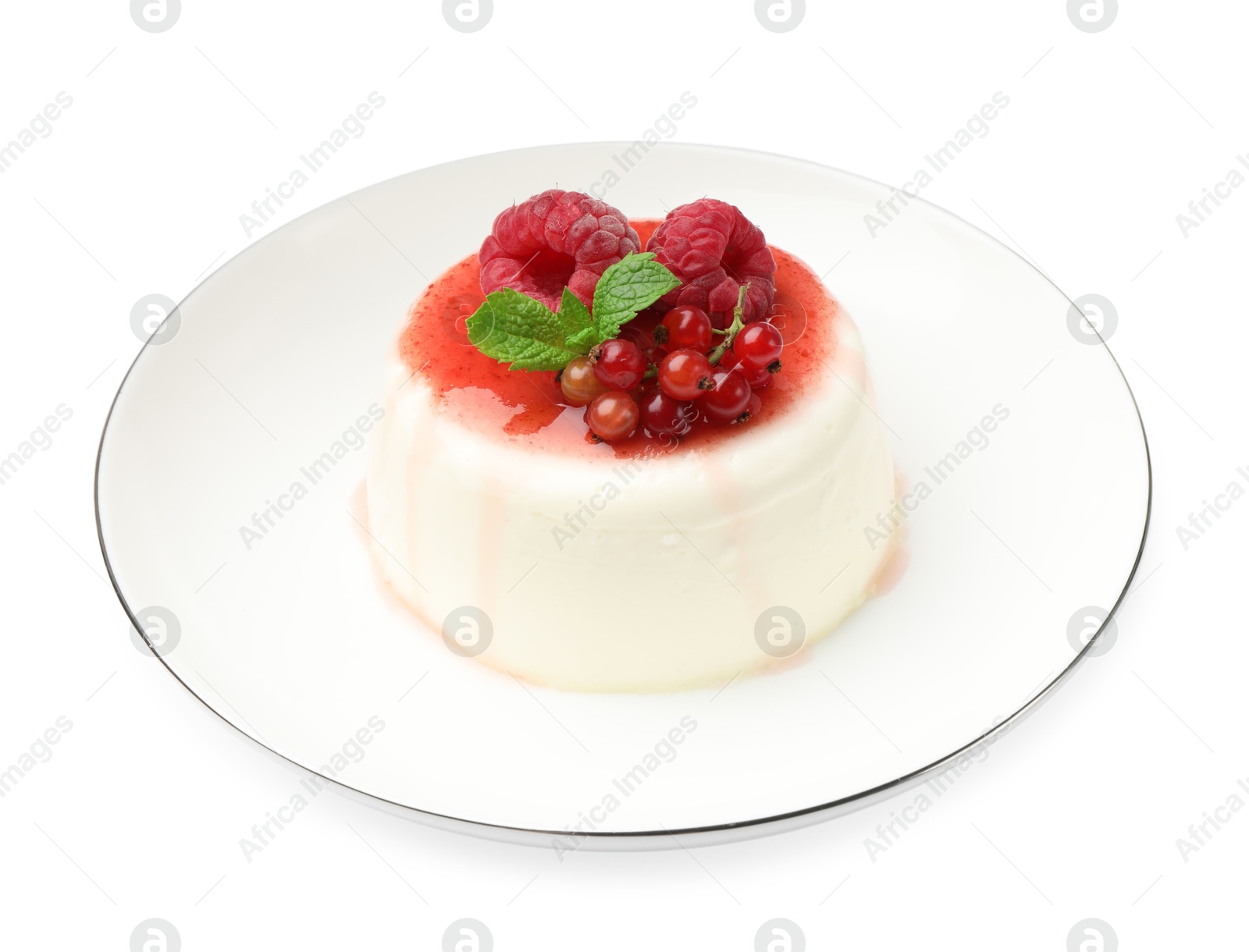 Delicious panna cotta with berries, sauce and mint isolated on white Photo of Delicious panna cotta with berries, sauce and mint isolated on white