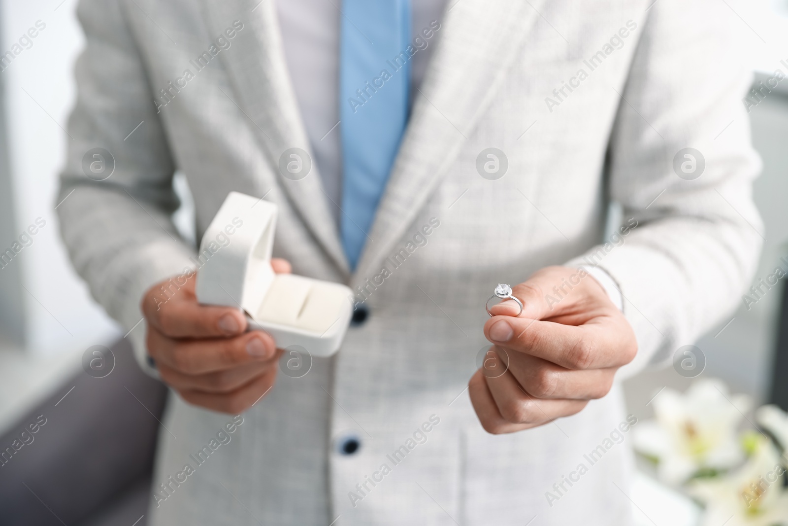 Making proposal. Man with engagement ring indoors, closeup Photo of Making proposal. Man with engagement ring indoors, closeup