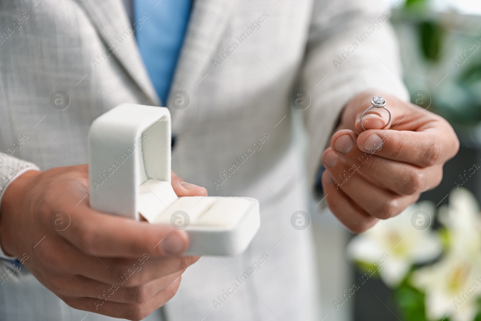 Making proposal. Man with engagement ring indoors, closeup Photo of Making proposal. Man with engagement ring indoors, closeup
