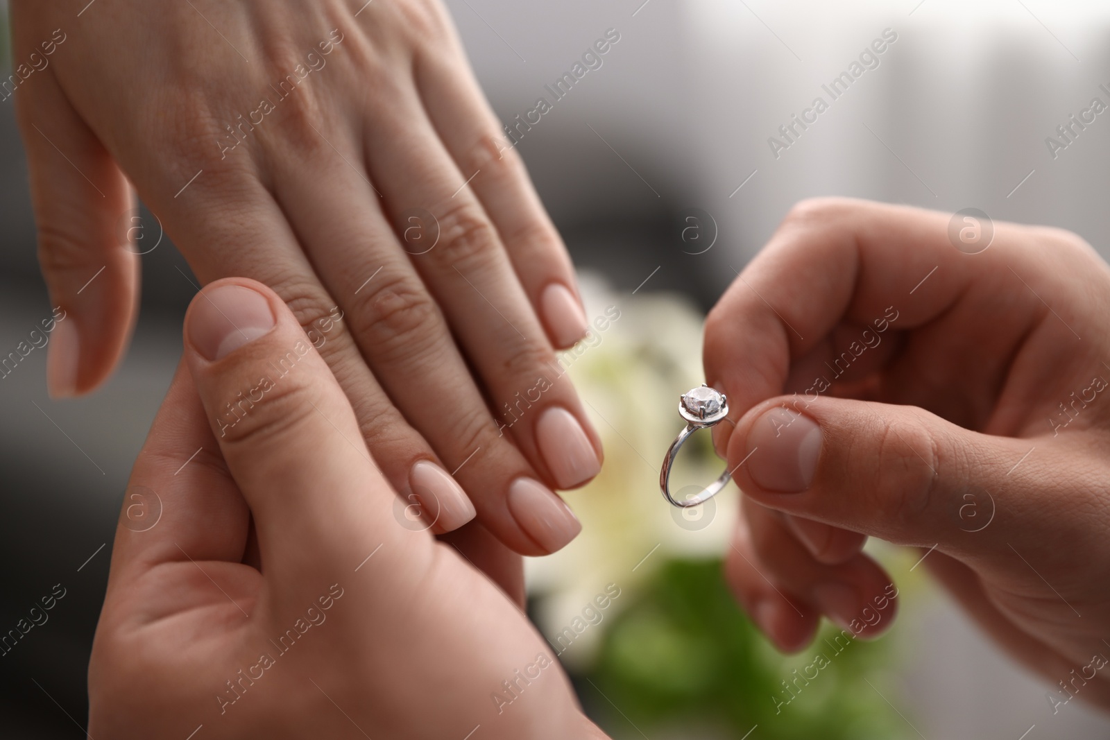 Man with engagement ring making marriage proposal to his girlfriend indoors, closeup Photo of Man with engagement ring making marriage proposal to his girlfriend indoors, closeup
