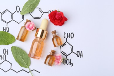 Photo of Bottles of cosmetic products, herbs and roses on paper with chemical formulas, flat lay. Space for text