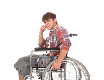 Photo of Smiling teenage boy in wheelchair on white background