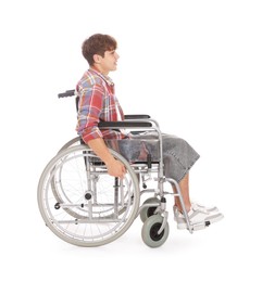 Photo of Teenage boy in wheelchair on white background