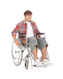 Photo of Smiling teenage boy in wheelchair on white background