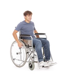 Photo of Smiling teenage boy in wheelchair on white background
