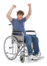 Photo of Smiling teenage boy in wheelchair on white background