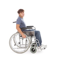 Photo of Smiling teenage boy in wheelchair on white background