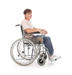 Photo of Smiling teenage boy in wheelchair on white background