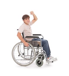 Photo of Smiling teenage boy in wheelchair on white background