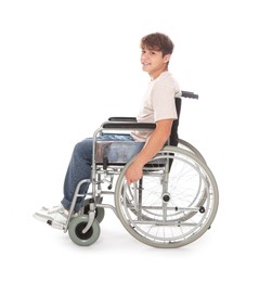 Photo of Smiling teenage boy in wheelchair on white background