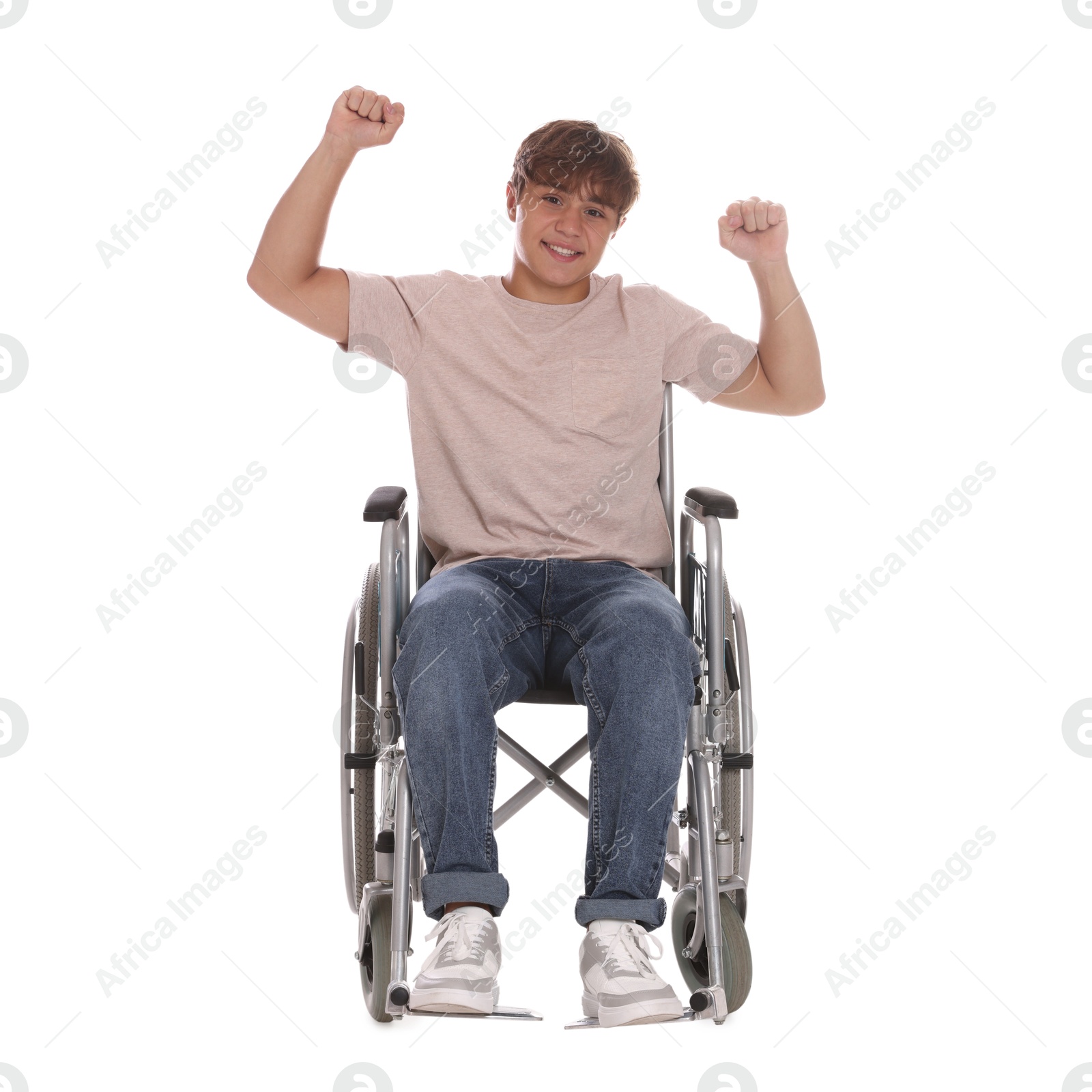 Photo of Smiling teenage boy in wheelchair on white background