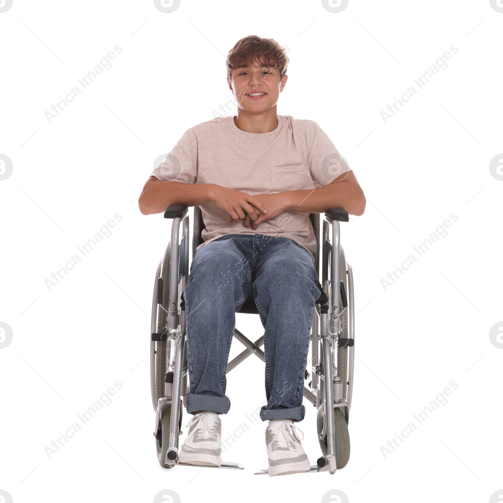 Photo of Smiling teenage boy in wheelchair on white background